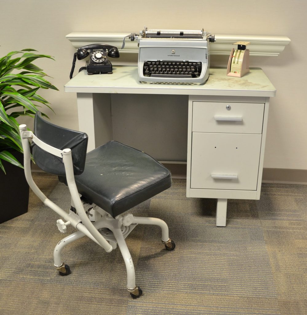 Diagonal view of a desk and typewriter