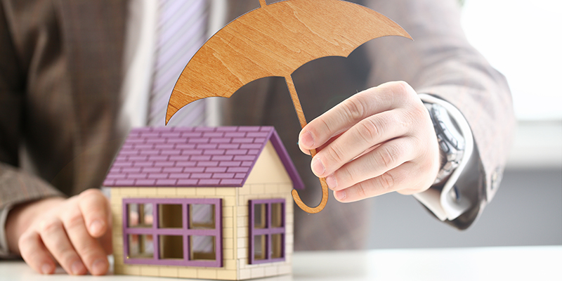 Male hand hold wooden umbrella aganist