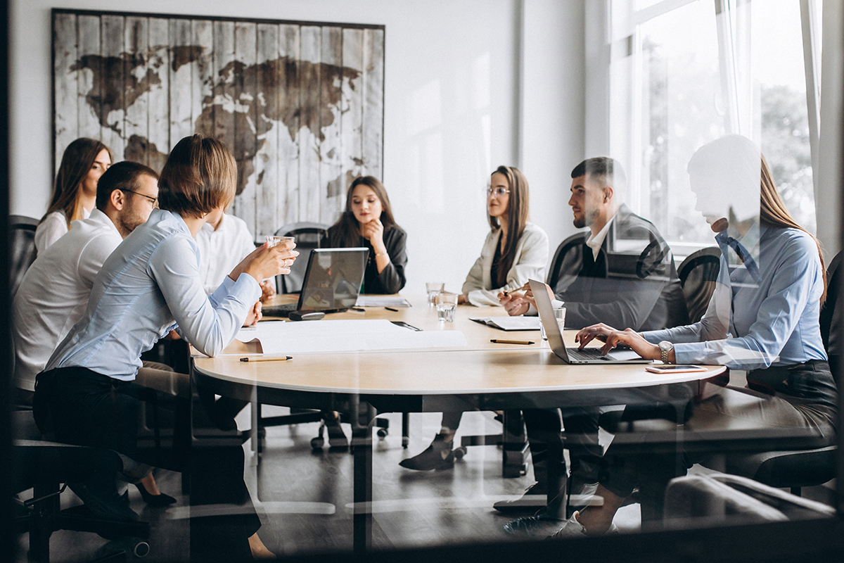 Group of people working out business plan in an office