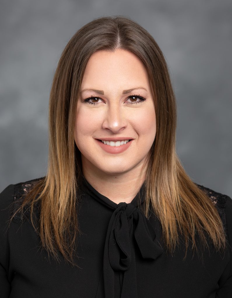 headshot of molly anderson smiling at the camera