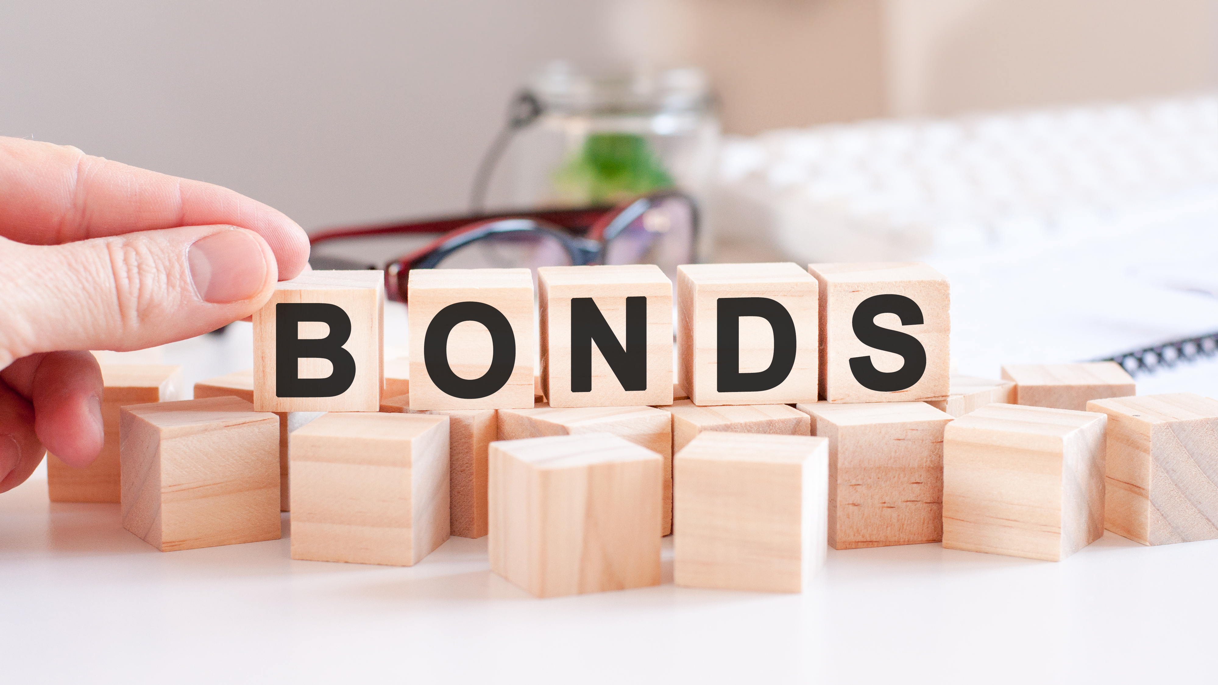 bonds word made with building wooden blocks,