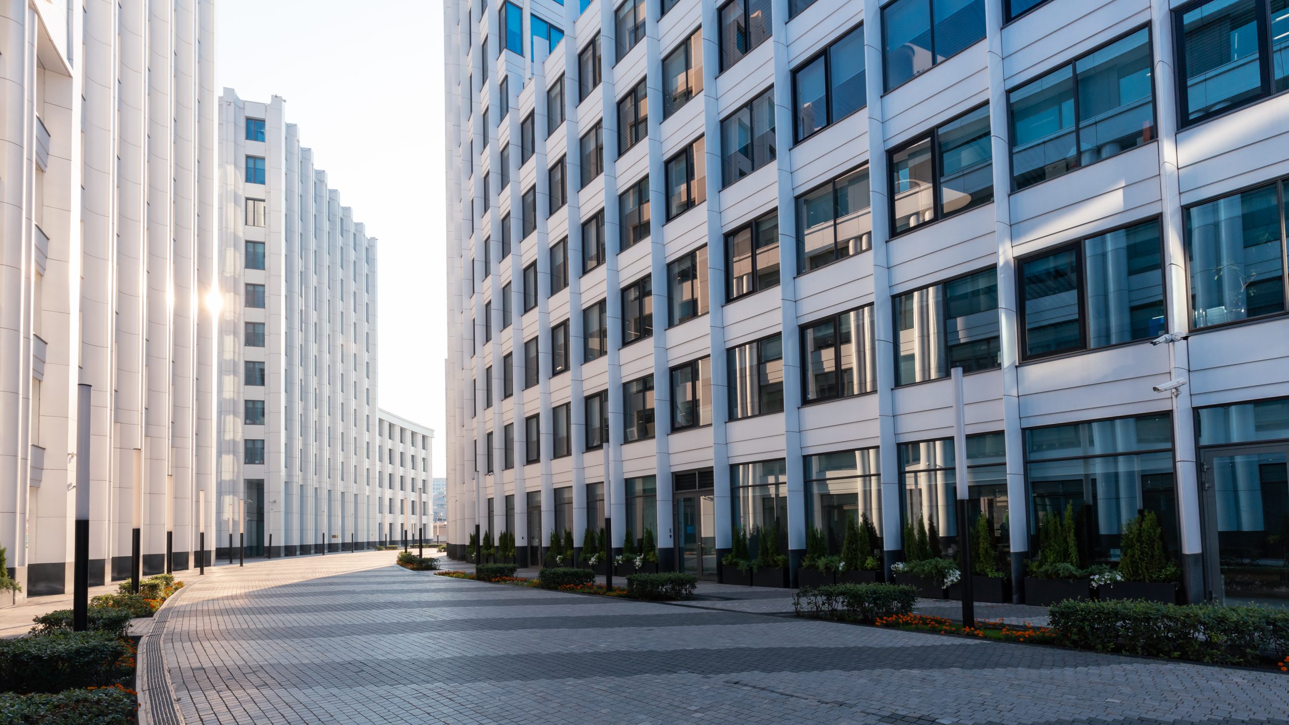Modern white office buildings in contrast light